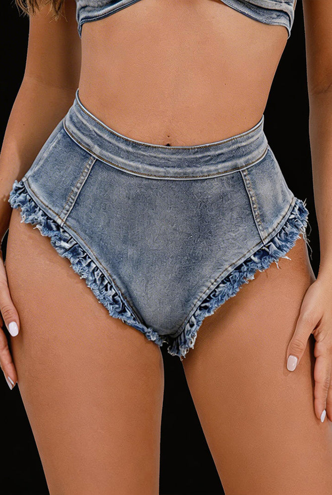 Light wash denim high-waisted shorts with frayed raw-edge hem, front view