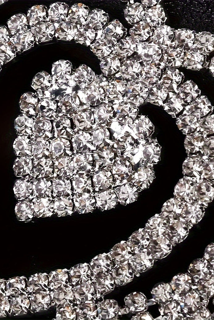 Rhinestone heart pendant and crystal chain detail on a black waist accessory