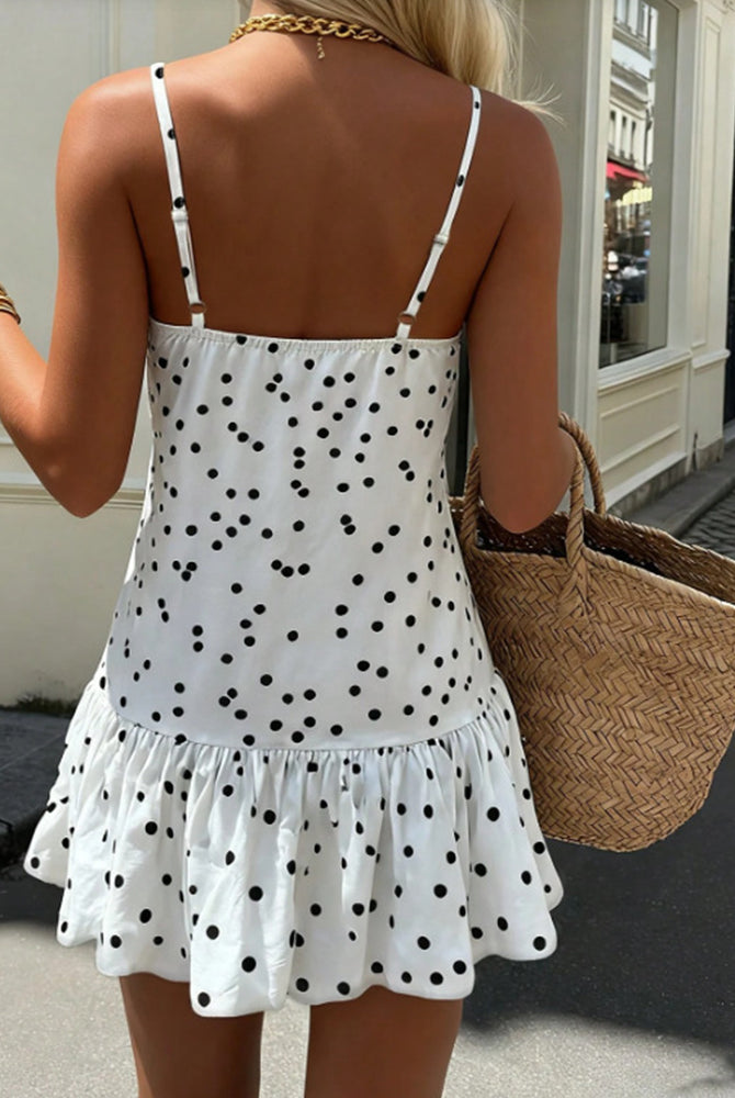White polka dot halter mini dress with open back and ruffled hem