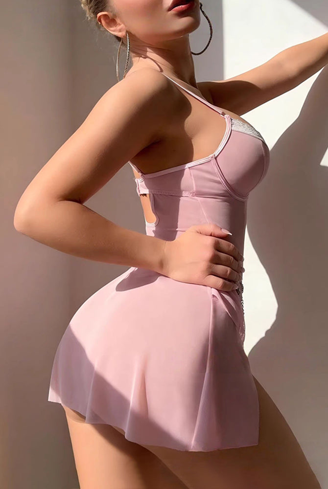 Pink babydoll mini dress with spaghetti straps, lace trim, and flared skirt