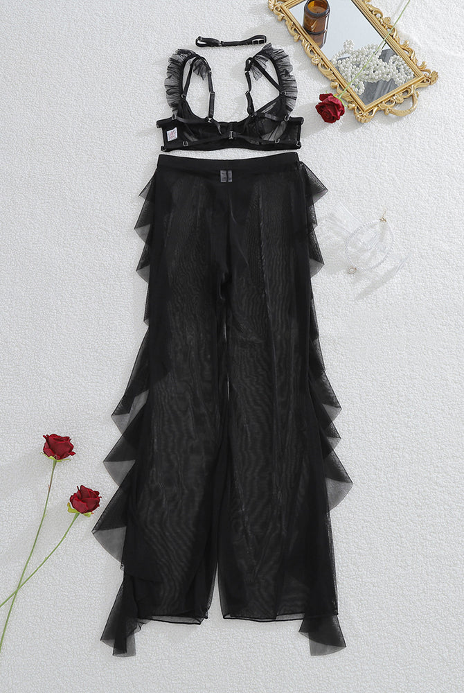 Black sheer lace bralette and mesh pants set with ruffled neckline, flat lay
