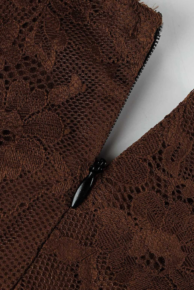 Brown lace bodysuit fabric close-up with black-trim seam detail