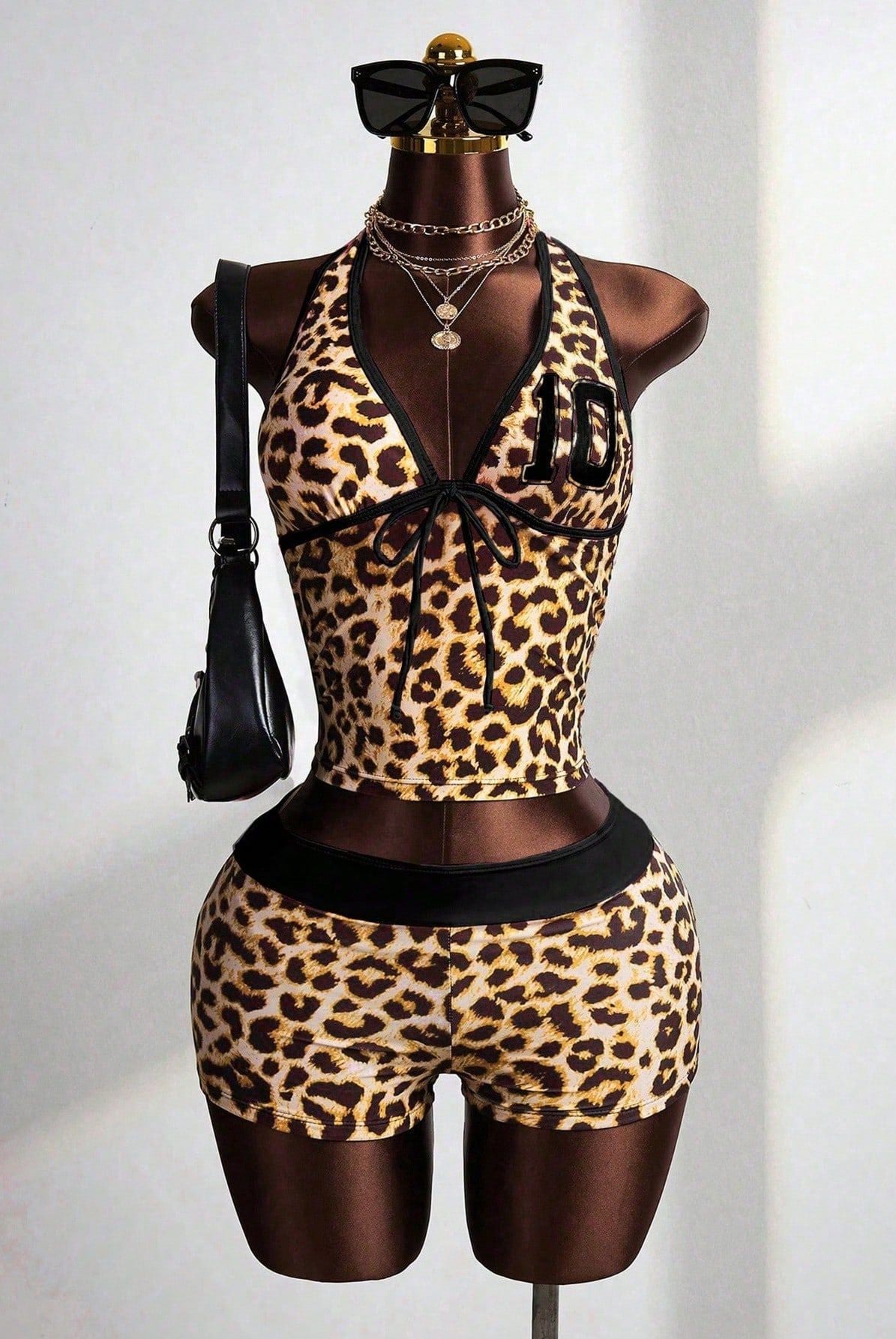 Leopard print halter crop top and high-waisted shorts set with black waistband trim