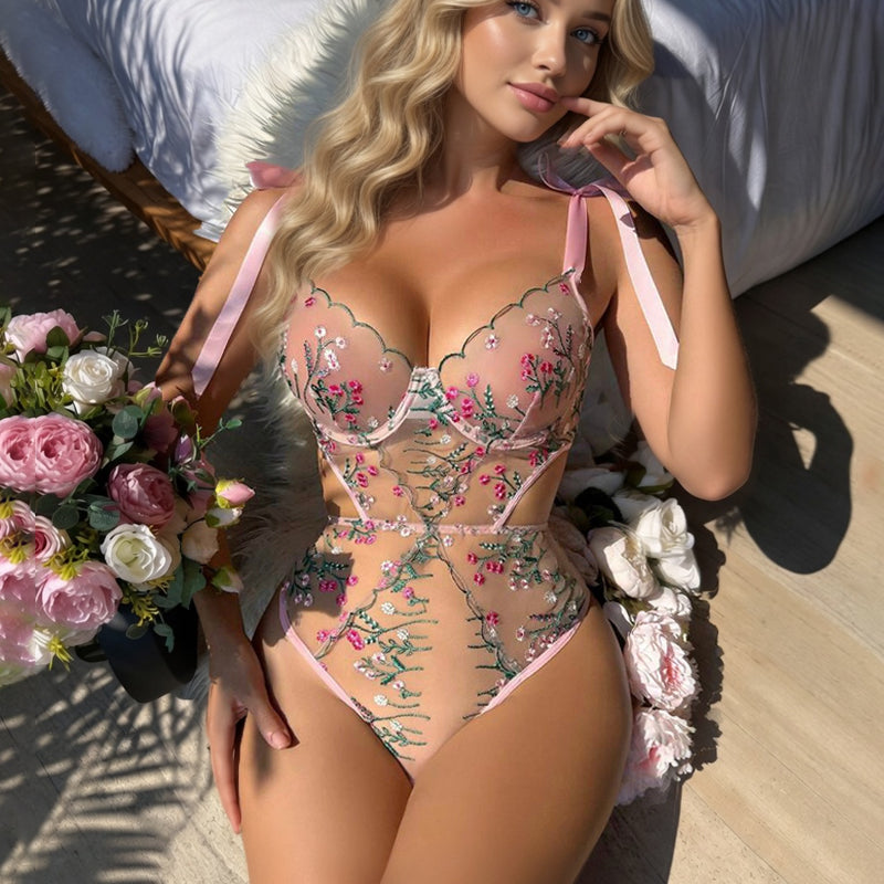 Pink sheer bodysuit with floral embroidery, plunge underwire and ribbon tie details