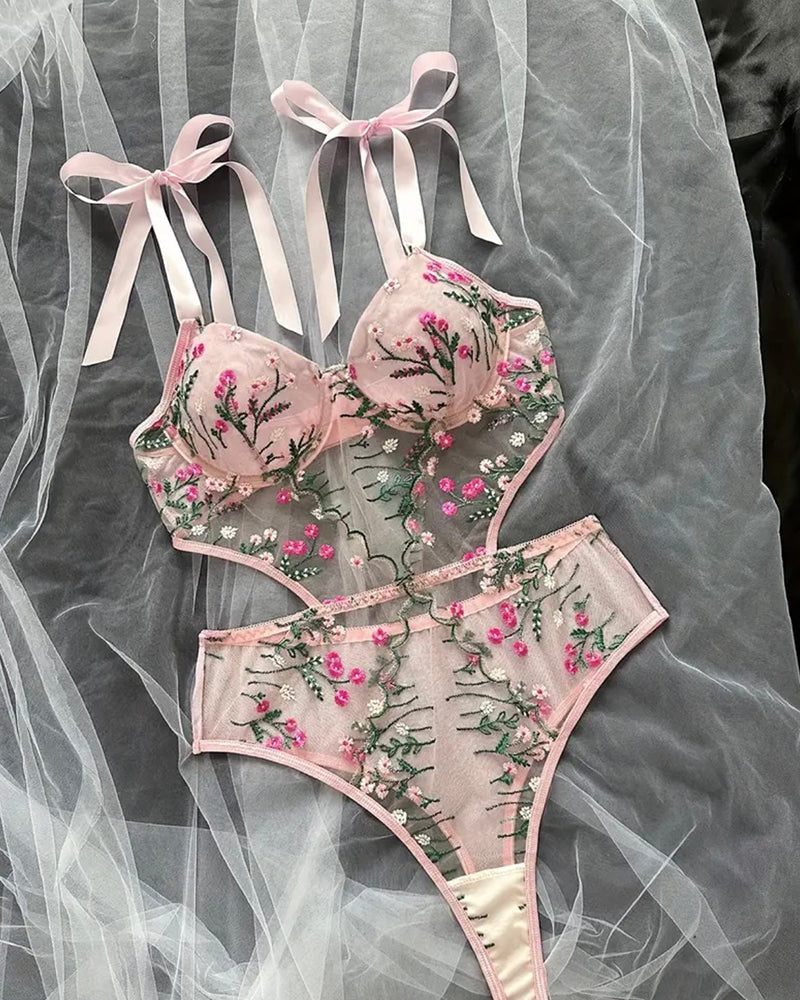Pink floral embroidered sheer bodysuit with bow shoulder ties and plunge cups