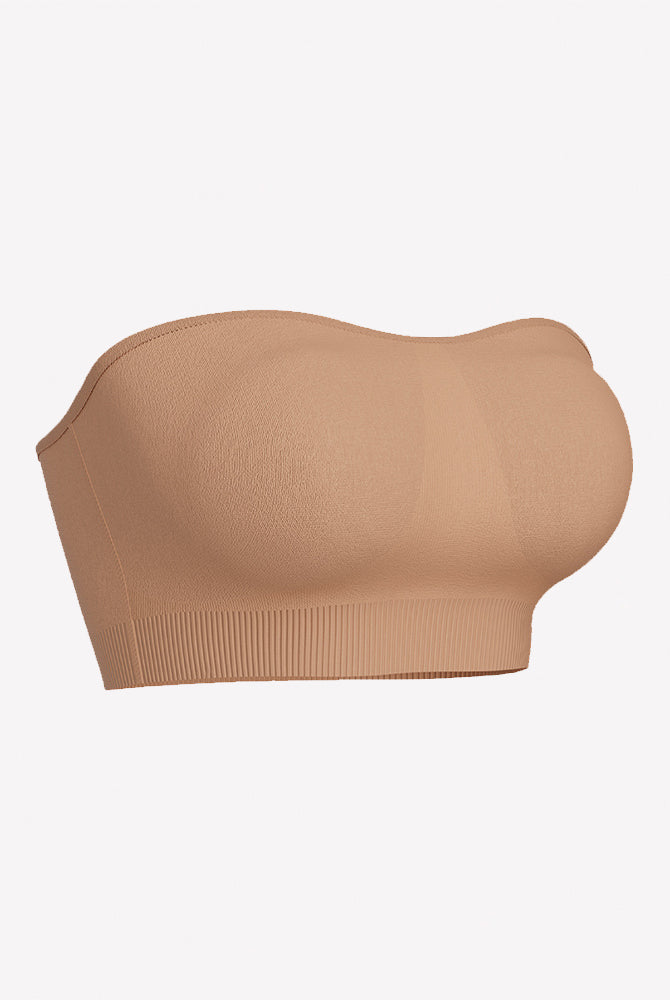 Skin-toned strapless bandeau bra with padded cups and ribbed bottom band