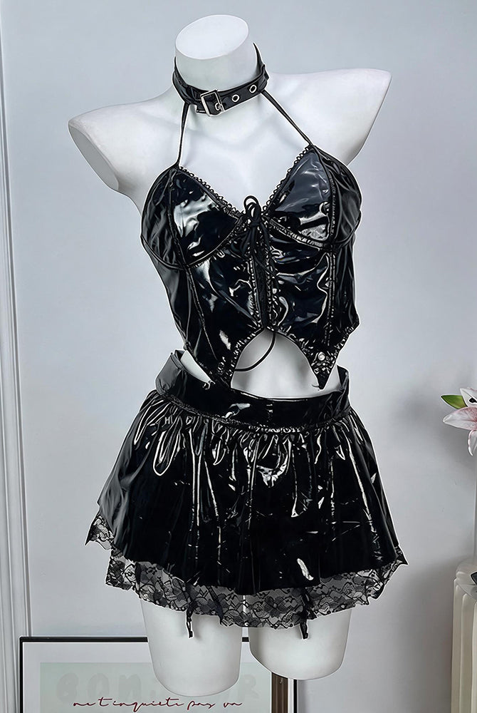 Black patent leather lingerie set: halter crop top, mini skirt, and choker on mannequin