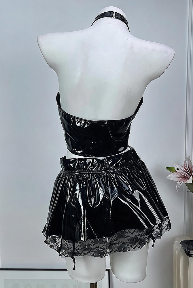 Back view of black patent halter crop top and mini skirt with choker on mannequin
