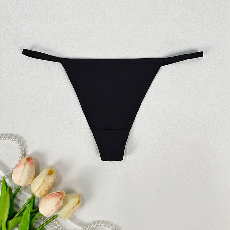 Low-rise thong panties in black with smooth seamless design and soft coverage.