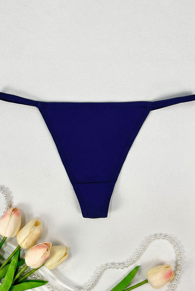 Low-rise thong panties in dark blue with smooth seamless design and soft coverage.