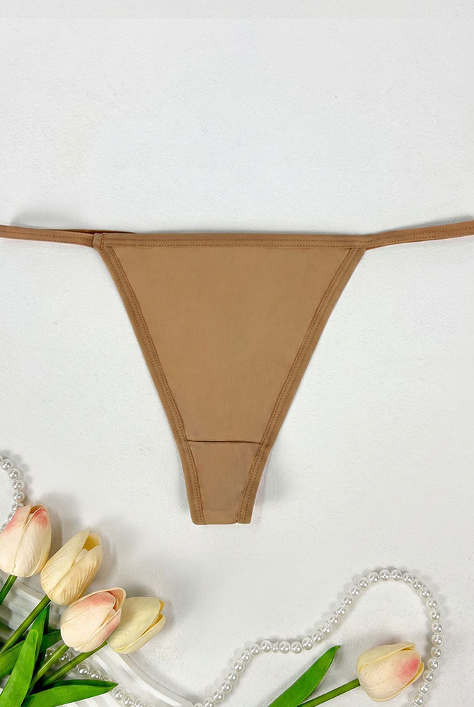 Low-rise thong panties in tan with smooth seamless design and soft coverage.