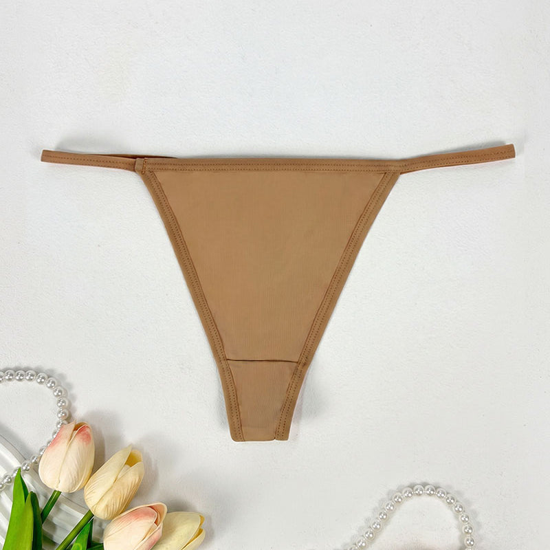 Low-rise thong panties in tan with smooth seamless design and soft coverage.