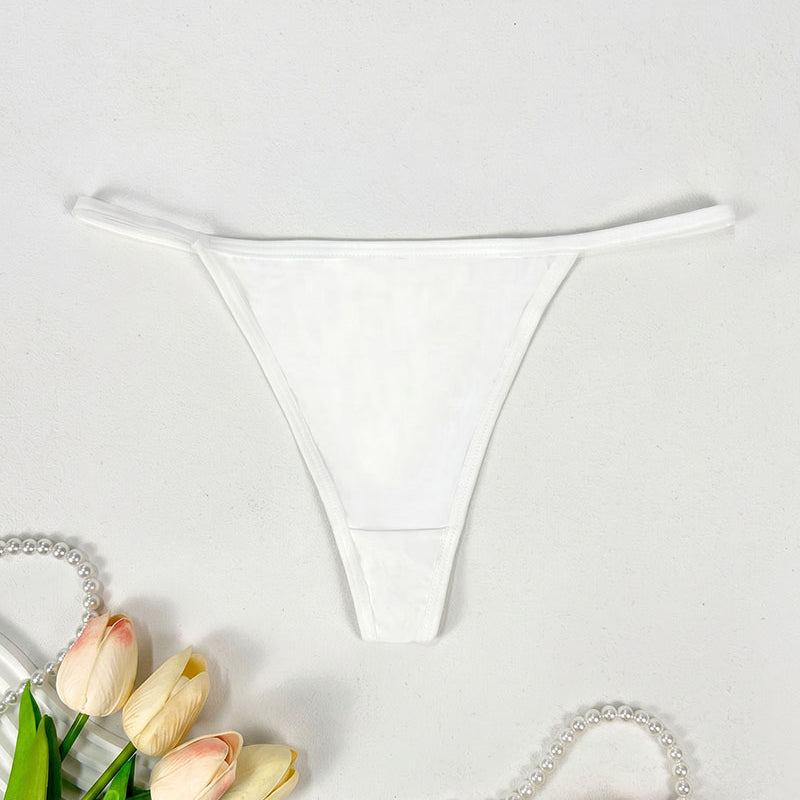 Low-rise thong panties in white with smooth seamless design and soft coverage.