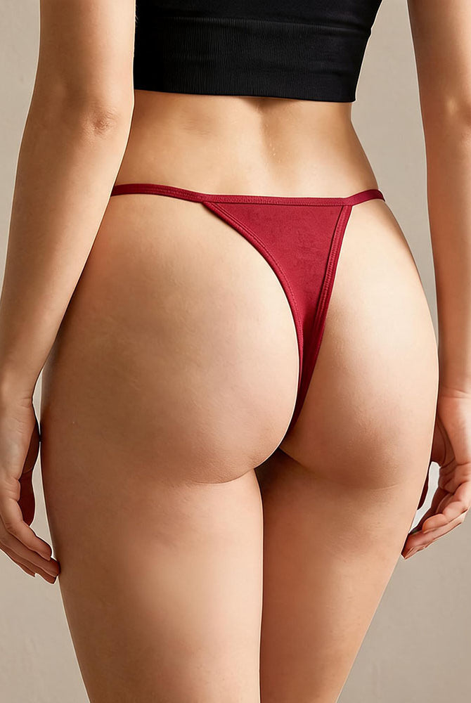 Low-rise thong panties in red with seamless soft stretch fabric, low-rise fit.