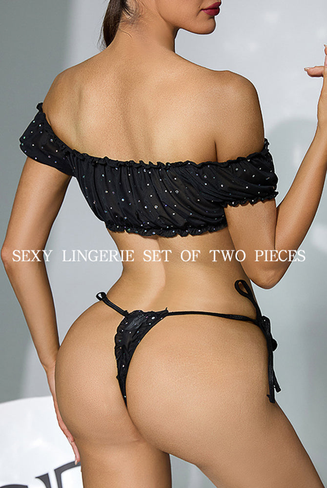 Back view of black off-shoulder sheer lingerie set with rhinestone trim and tie-side thong