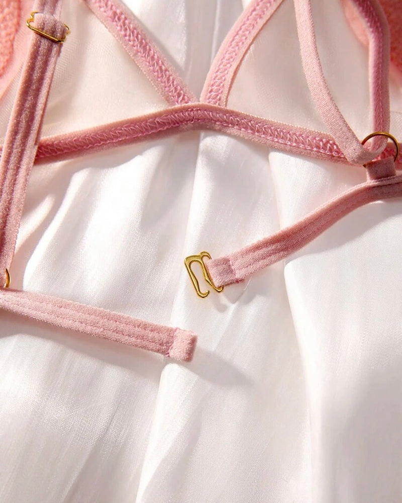 Pink sheer bra straps with heart appliqué and gold adjuster hardware