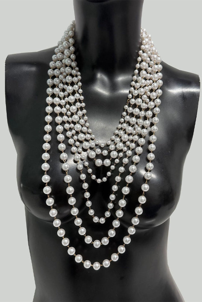 Pearl body chain with multi-row beaded ropes forming a V at the chest