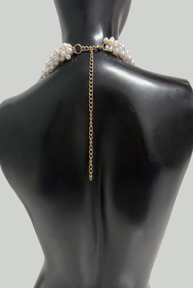 Pearl body chain with gold-tone chain and clasp; pearl bands sit at shoulders