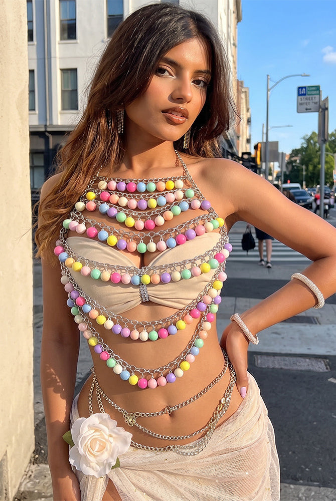 Multicolor beaded body chain with layered pastel pom-pom strands and metal connectors