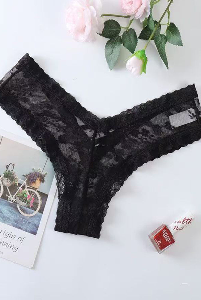 Black lace mesh low rise thong panties, flat lay with scalloped edges