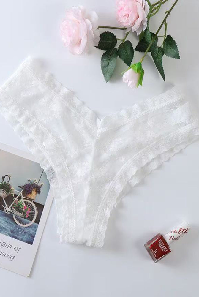 White lace mesh low rise thong panties, flat lay with scalloped lace edges