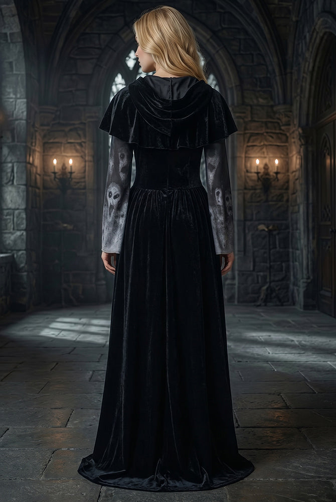Black long-sleeve maxi dress with hooded skull-print cape and gathered back skirt