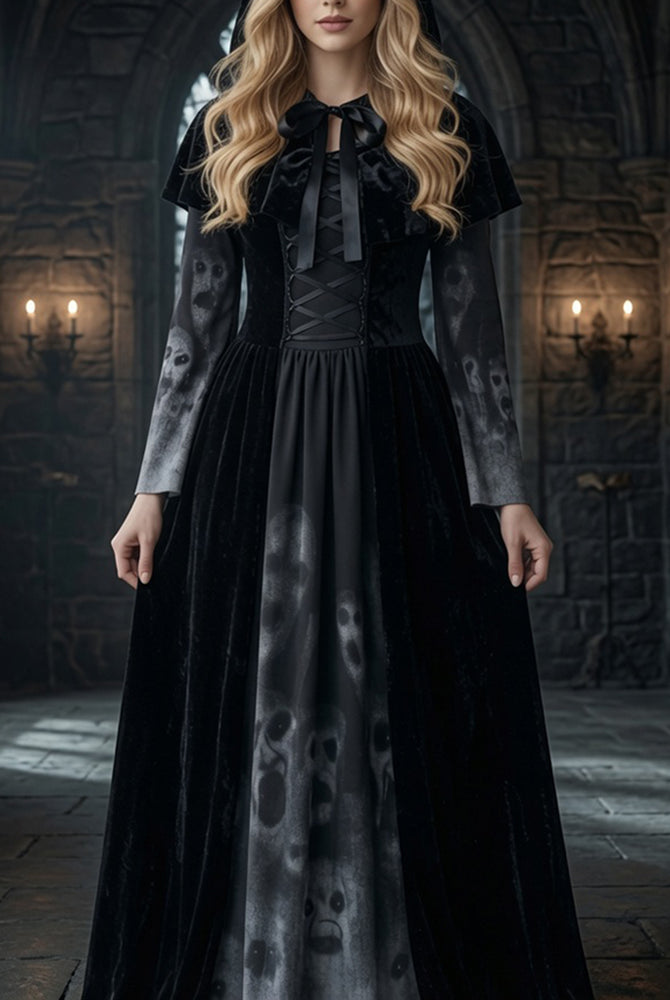 Black maxi dress with tie-neck bodice, long sleeves, corset waist, and skull-print skirt panel
