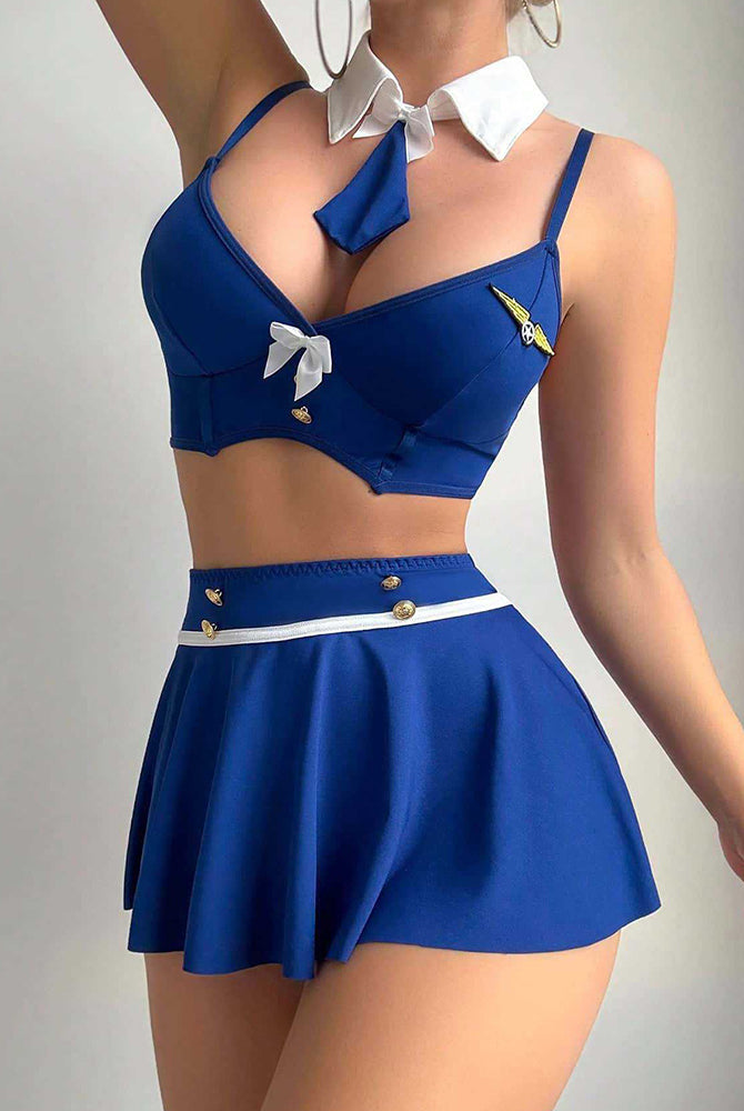 Dark blue bra and pleated mini skirt with white waist belt, ribbon bow, and collar