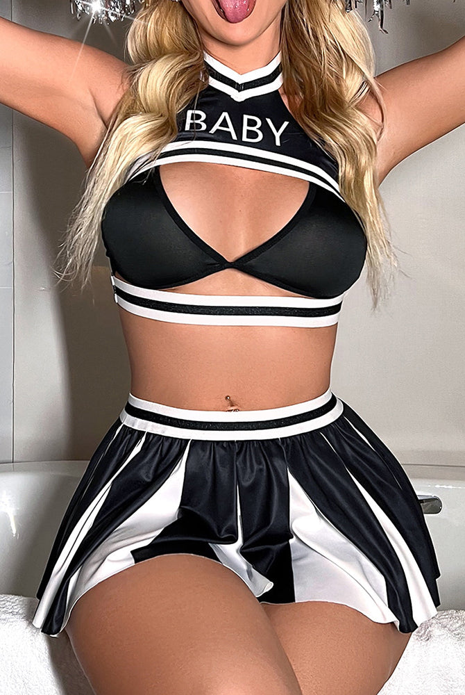 Black cheerleader lingerie set: cut-out bra and flared pleated skirt with white trim.