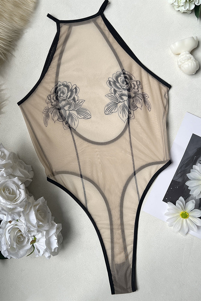 Sheer mesh rose print bodysuit with black trim and high-cut leg