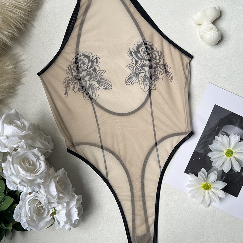 Sheer mesh rose print bodysuit with black trim and high-cut leg