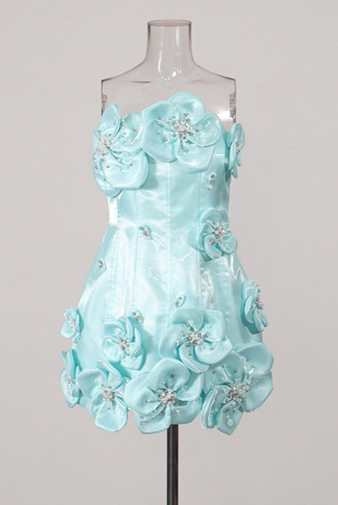 Sky blue strapless corset mini dress on a mannequin with 3D floral appliques and beads.
