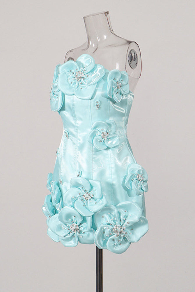 Sky blue strapless corset mini dress on a mannequin with layered flower embellishments.