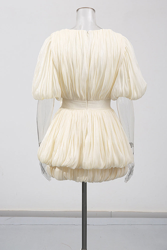 Champagne mini dress on mannequin with pleated puff sleeves and gathered waist