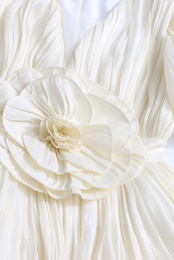 Champagne pleated mini dress with puff sleeves and large rosette floral waist detail