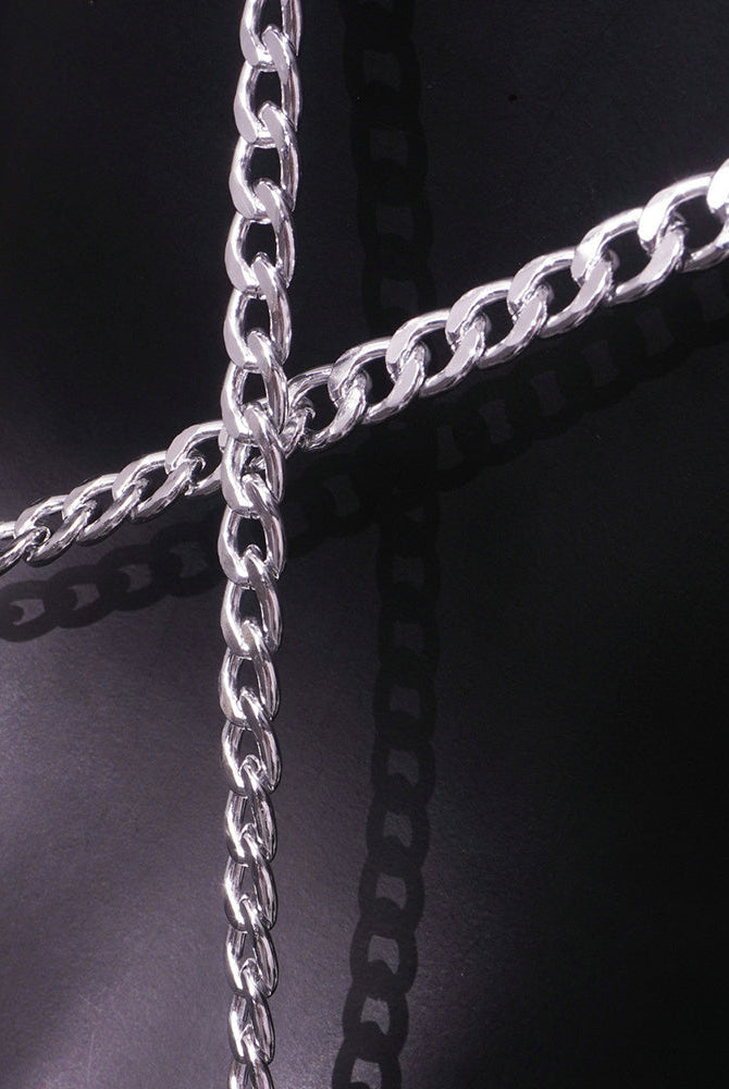 Close-up of shiny silver chain links with looped connectors.