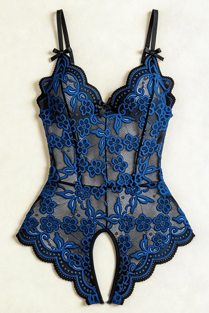 Black and blue floral lace crotchless teddy with v-neck and bow straps, flat lay