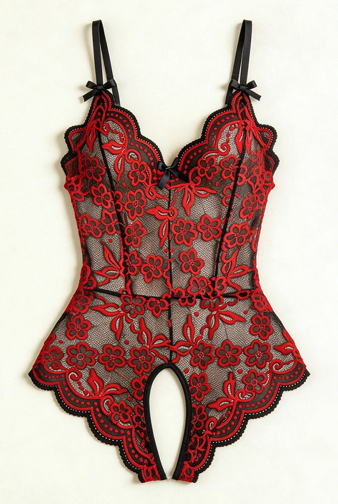 Flat-lay red and black floral lace crotchless teddy with V-neck and bow straps.