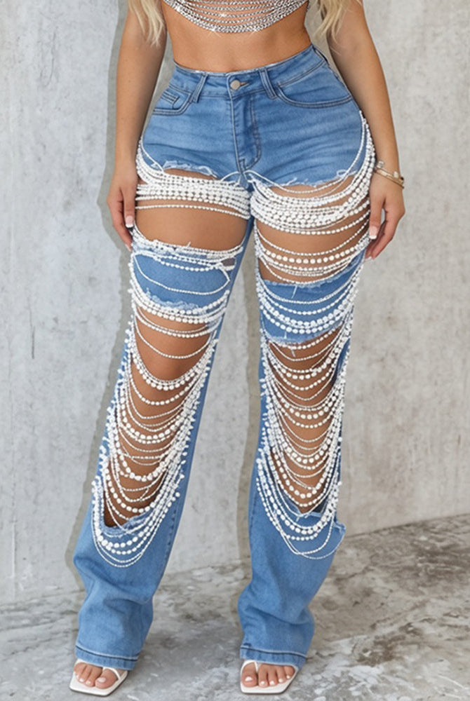 Light blue ripped denim jeans with pearl chain drape and frayed edges