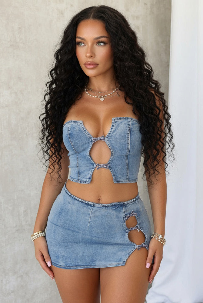 Light blue denim bustier crop top and mini skirt with bow tie cutout