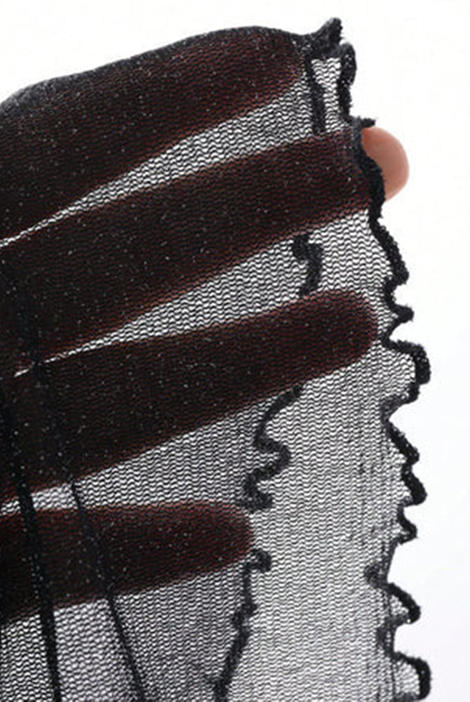 Black glitter sheer fabric close-up with scalloped edge trim