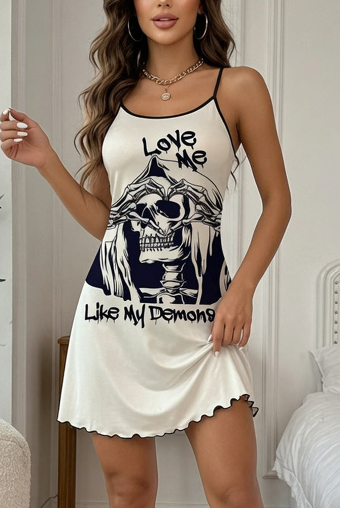 Cream mini slip dress with skull graphic front, spaghetti straps, scalloped hem
