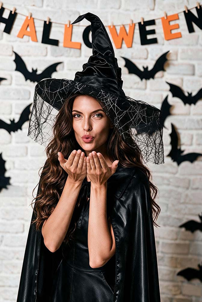Black witch hat with spiderweb veil, wide brim and pointed crown on model
