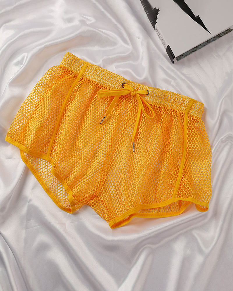 Yellow open mesh drawstring shorts with elastic waistband and matching drawstring.