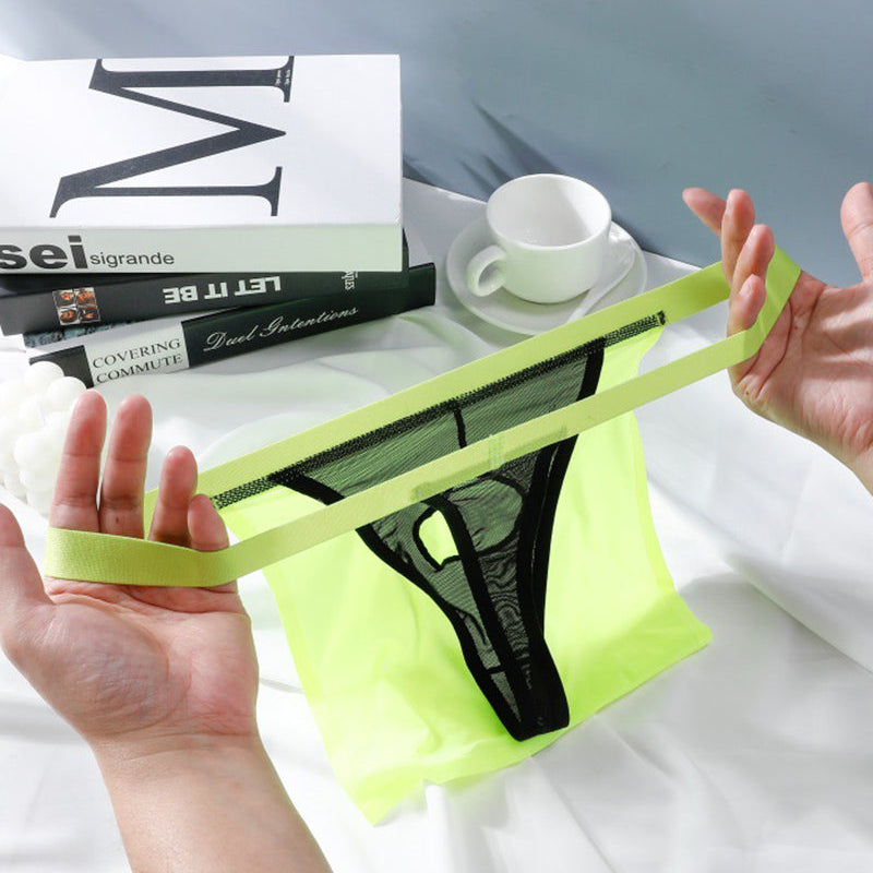 Sheer black G-string thong with neon green elastic waistband
