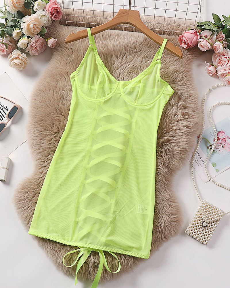 Neon green sheer mesh underwire mini dress laid flat with fringe tie hem