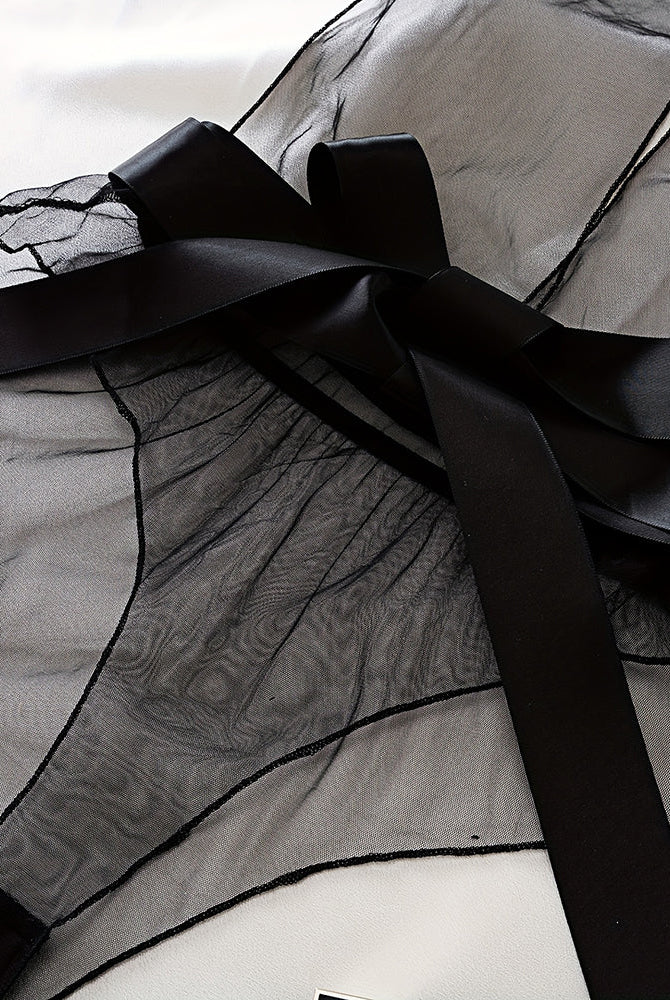 Black sheer mesh bodysuit detail: satin bow and wide ribbon ties