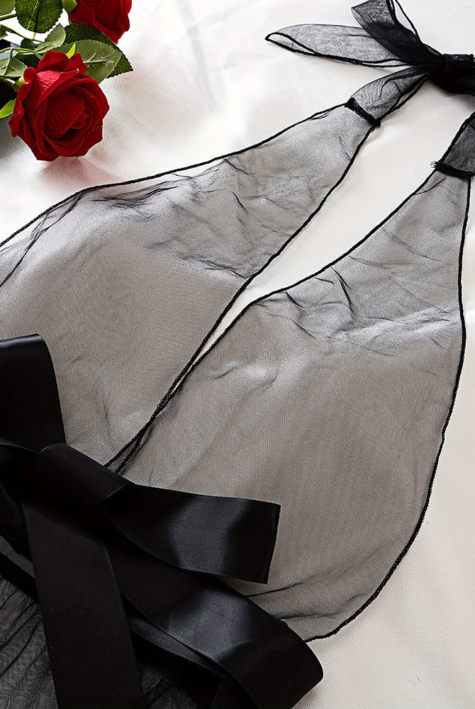 Black sheer mesh halter bodysuit with satin bow and long ribbon ties, flat lay
