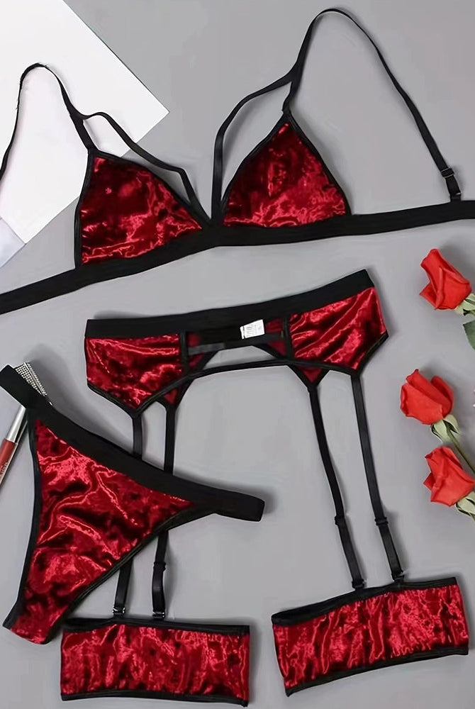 Wine red velvet lingerie set pieces: bra, panty, waist belt, and leg garters