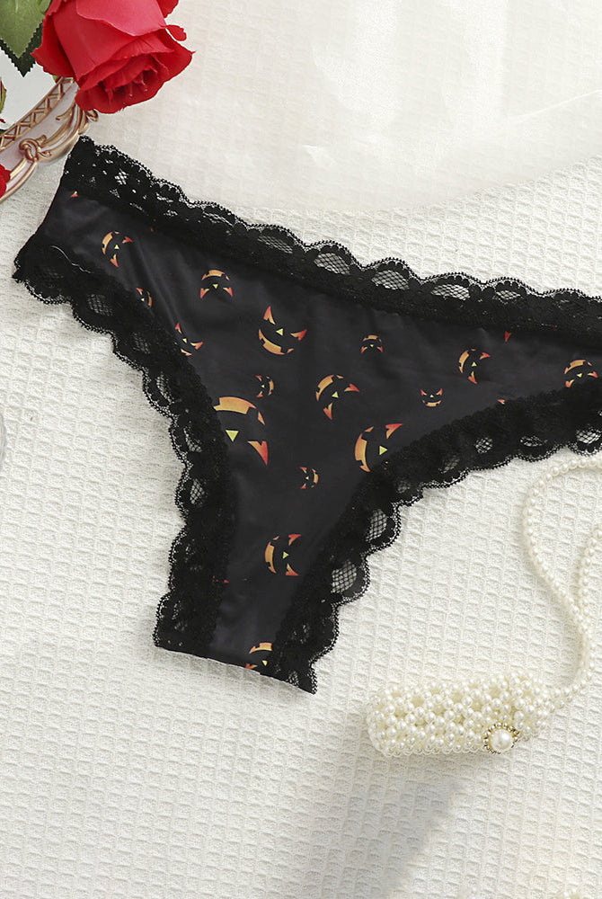 Black lace-trim thong panty with orange Halloween pumpkin print